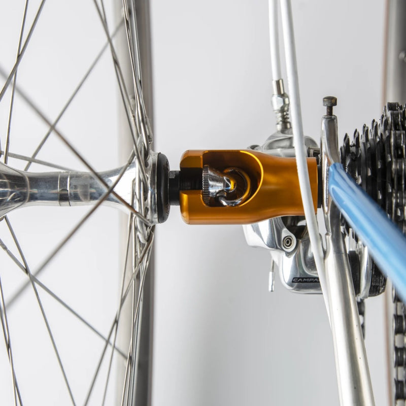 Replace your rear wheel’s axle nut with the stainless Hogg nut and then you can screw on the Hogg body when you’re ready to transport your bike. Your front wheel’s quick-release skewer clamps onto the Hogg body and off you go!