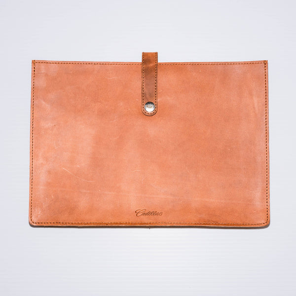 This laptop sleeve made of premium Buffalo leather acts as a document holder while holding up to a 14.5" laptop.